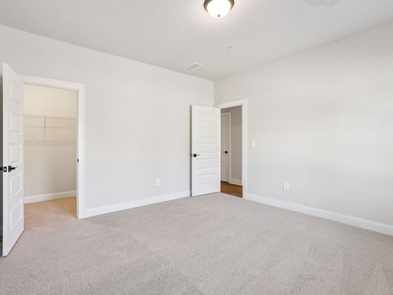 Spacious, unfurnished interior of a new home in Hemingway - Highland Series, Cumming (Image 16). Spacious, unfurnished interior of a new home in Hemingway - Highland Series, Cumming (Image 16).