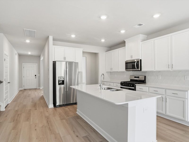 Furnished interior view inside a new home in The Farm at Wells Creek - Signature Collection, Gray Court (Image 4).
