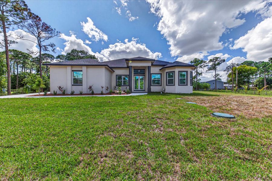 Exterior details and patio area of a home in , The Acreage (Image 32). Exterior details and patio area of a home in , The Acreage (Image 32).