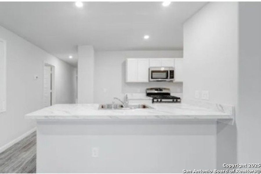 Furnished interior view inside a new home in Las Colinas, Kenedy (Image 6).