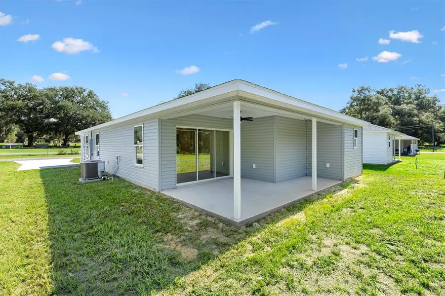 Exterior details and patio area of a home in , Bushnell (Image 3).