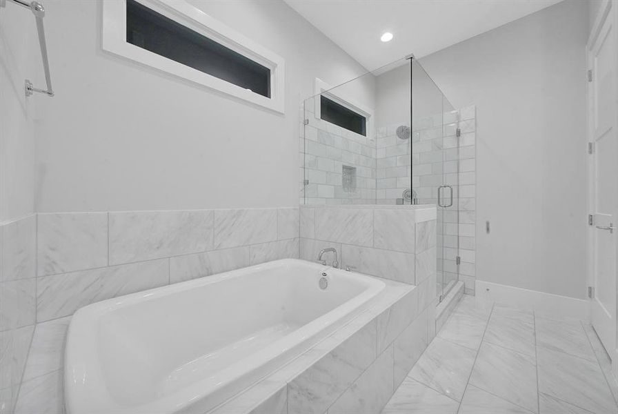 Luxurious ensuite bathroom that offers the ultimate in relaxation and convenience.