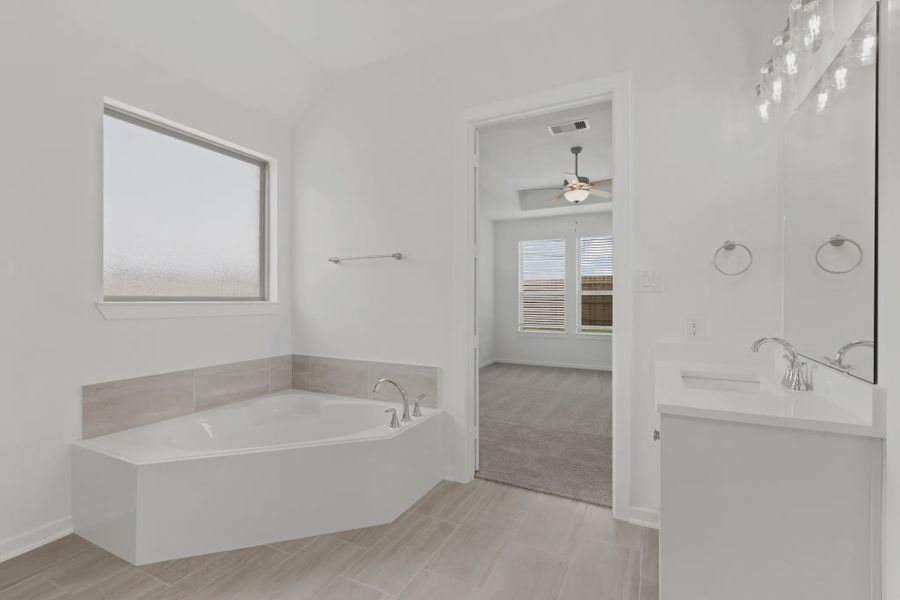 Representative furnished interior of a home built from the Payton by Chesmar Homes in The Highlands, Porter (Image 5).