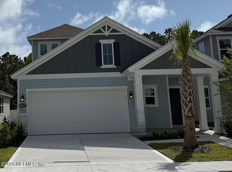 Front exterior of a new home in The Preserve at Concourse Crossing, Fernandina Beach, FL, highlighting curb appeal (Image 1).