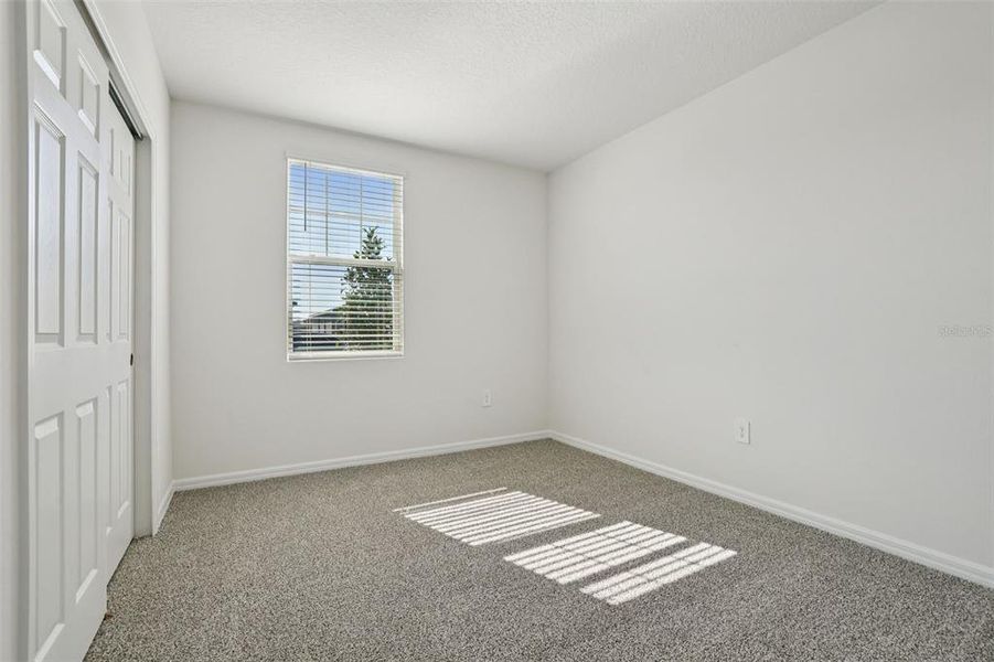 Spacious, unfurnished interior of a new home in Lake Deer Estates - Signature Series, Poinciana (Image 21).