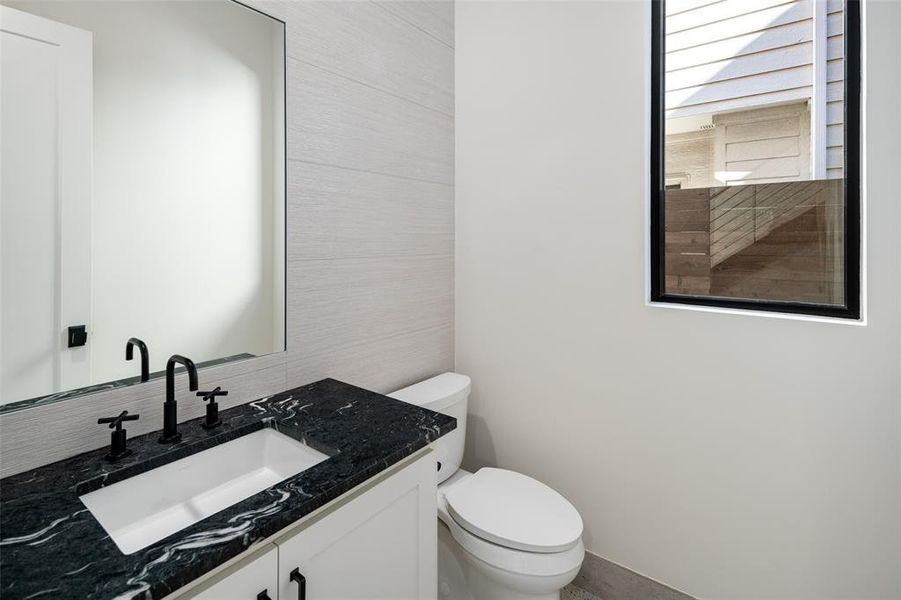 Bathroom featuring vanity and toilet