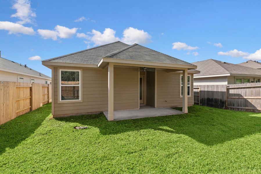 Exterior details and patio area of a home in Pinewood at Grand Texas, New Caney (Image 2).