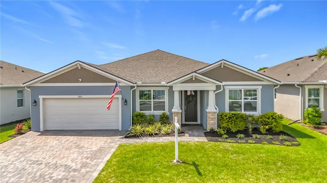 Front exterior of a new home in Windwater, Parrish, FL, highlighting curb appeal (Image 21). Front exterior of a new home in Windwater, Parrish, FL, highlighting curb appeal (Image 21).