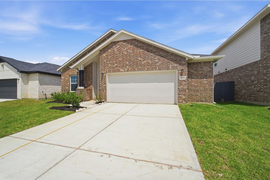 Front exterior of a new home in Bay Creek, Baytown, TX, highlighting curb appeal (Image 17).