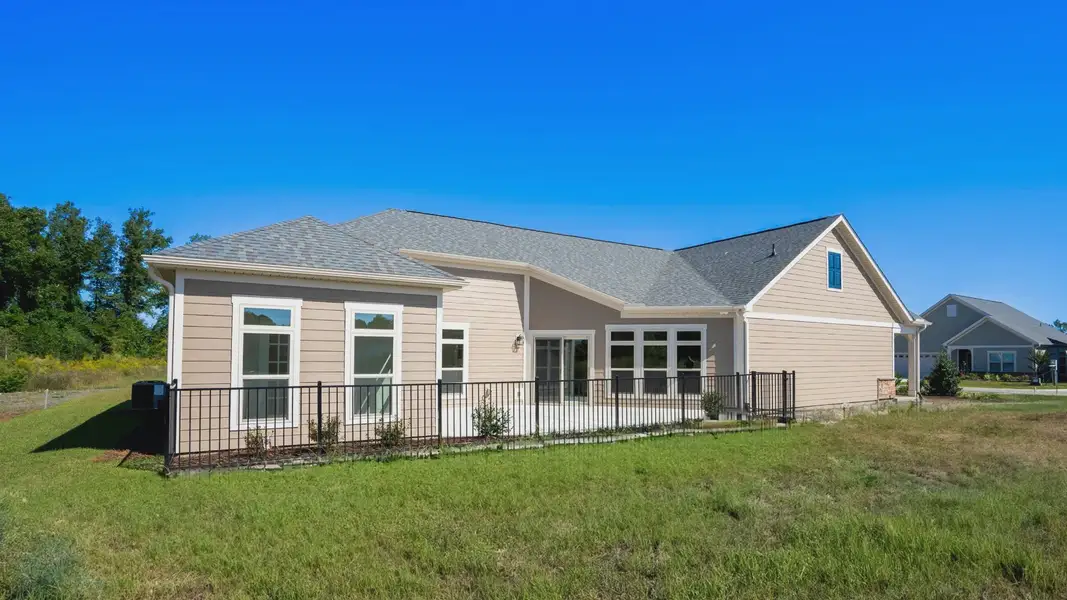 Exterior details and patio area of a home in Courtyards by Carrell, Ocean Isle Beach (Image 4). Exterior details and patio area of a home in Courtyards by Carrell, Ocean Isle Beach (Image 4).