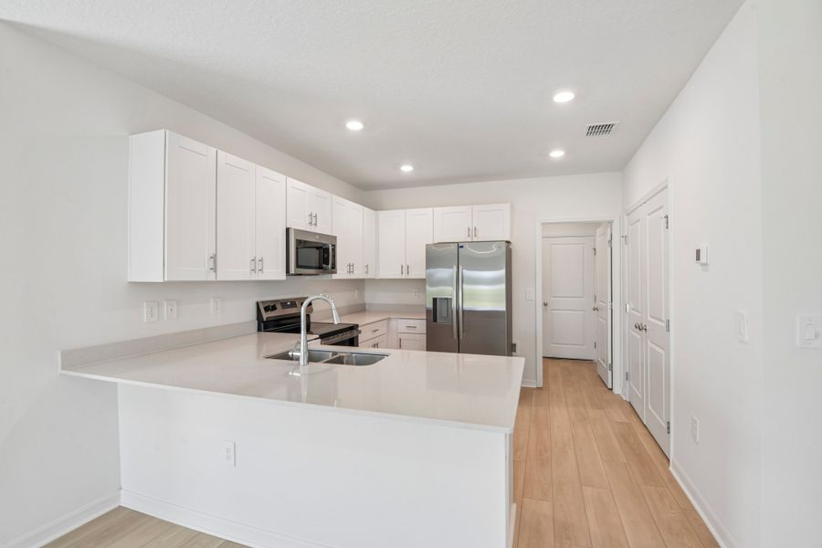 Representative furnished interior of a home built from the Blackbird by Taylor Morrison in Westview Community Group Page, Kissimmee (Image 4).