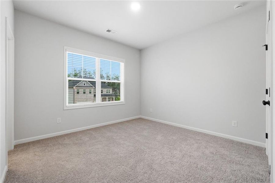 Spacious, unfurnished interior of a new home in The Stables at Ewing Chapel, Dacula (Image 29).