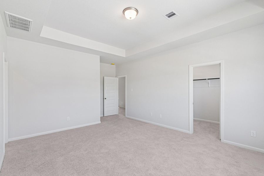 The Oriole II- Primary Bedroom with Tray Ceiling. Home under construction. Sample floor plan photo used for illustrative purposes only. Upgrades, selections options, and colors will vary. The Oriole II- Primary Bedroom with Tray Ceiling. Home under construction. Sample floor plan photo used for illustrative purposes only. Upgrades, selections options, and colors will vary.