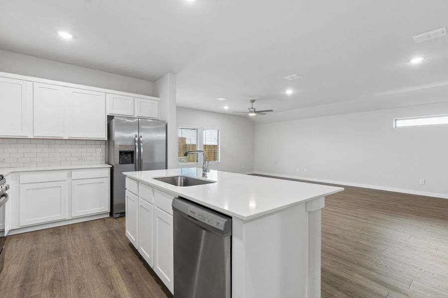 Kitchen in the Oscar home plan by Trophy Signature Homes – REPRESENTATIVE PHOTO