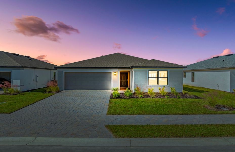 Front exterior of a new home in Caloosa Cove, Labelle, FL, highlighting curb appeal (Image 17).