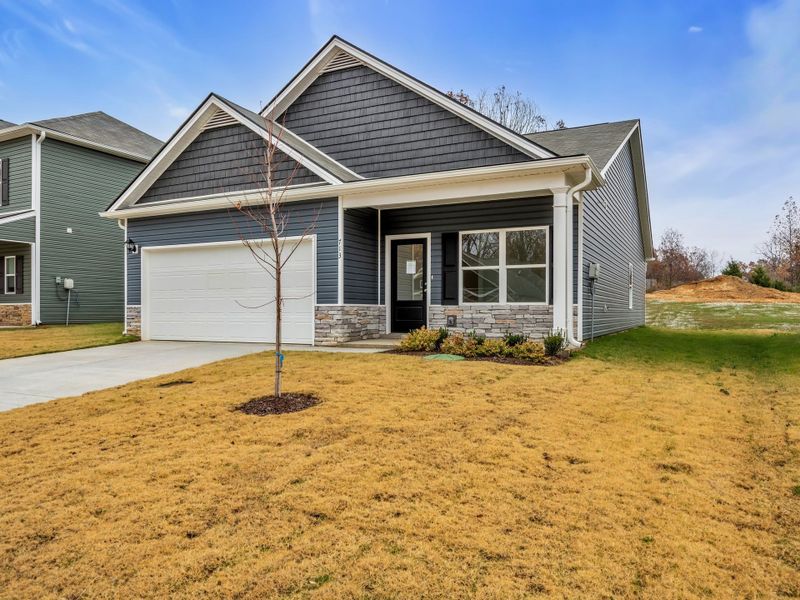 Front exterior of a new home in Cantigny Park, Clarksville, TN, highlighting curb appeal (Image 2).