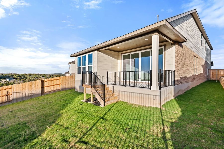 Exterior details and patio area of a home in Terrace Collection at Lariat, Liberty Hill (Image 27).