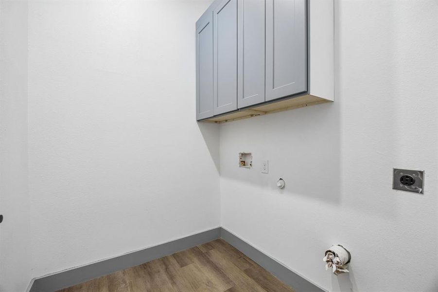 Laundry room with great storage.