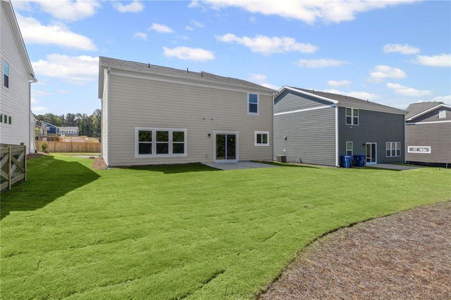 Front exterior of a new home in Sage Woods, Dallas, GA, highlighting curb appeal (Image 18). Front exterior of a new home in Sage Woods, Dallas, GA, highlighting curb appeal (Image 18).