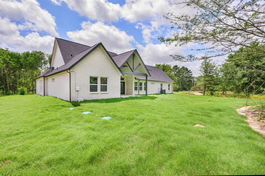 Front exterior of a new home in , Terrell, TX, highlighting curb appeal (Image 1).