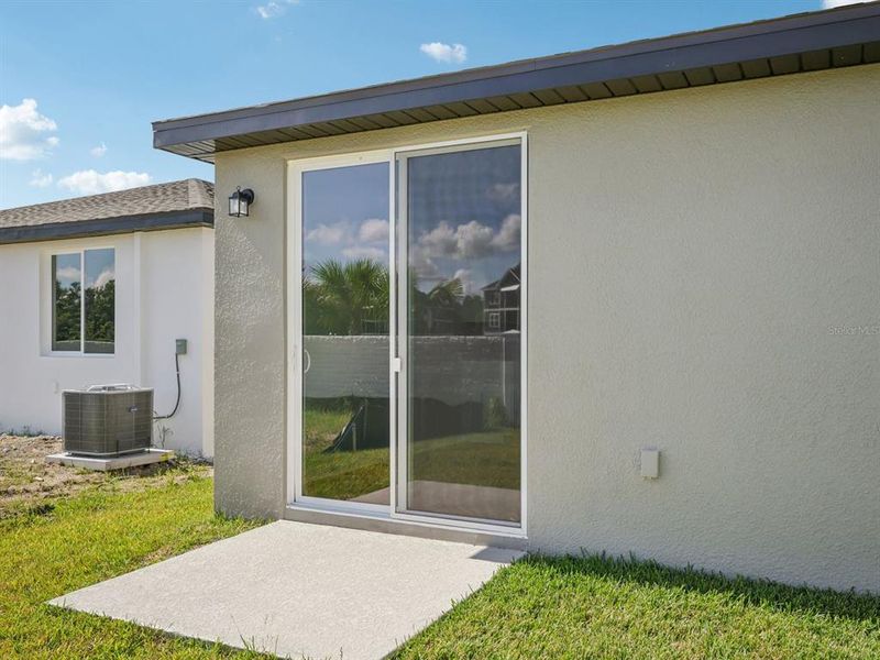 Exterior details and patio area of a home in The Grove at Stuart Crossing - Classic Series, Bartow (Image 3). Exterior details and patio area of a home in The Grove at Stuart Crossing - Classic Series, Bartow (Image 3).