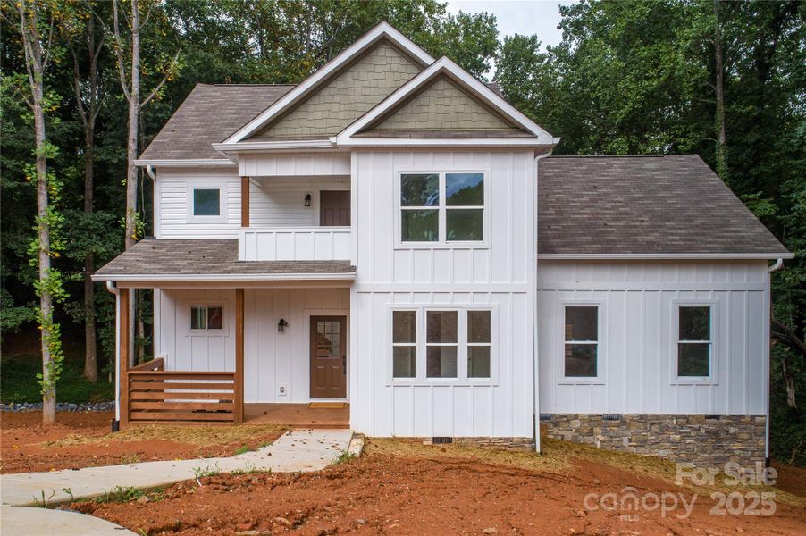 Front exterior of a new home in , Hickory, NC, highlighting curb appeal (Image 1).