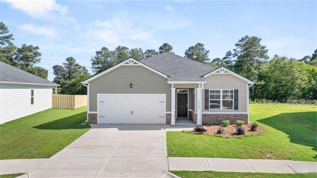 Front exterior of a new home in Poplar Preserve, Newnan, GA, highlighting curb appeal (Image 2).