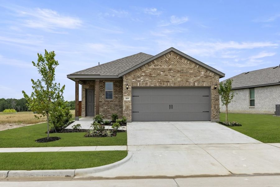 Representative exterior photo of a completed home built from the Cottonwood by Impression Homes in Northspur, Terrell, TX (Image 1).