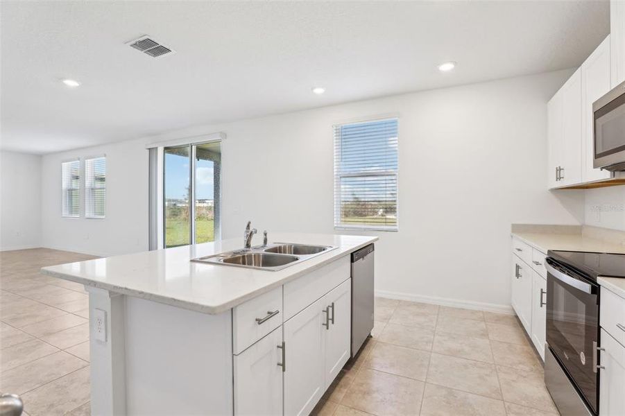 Furnished interior view inside a new home in Lake Deer Estates - Signature Series, Poinciana (Image 9). Furnished interior view inside a new home in Lake Deer Estates - Signature Series, Poinciana (Image 9).