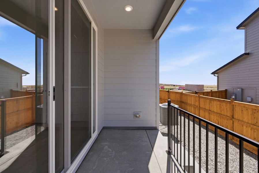 Exterior details and patio area of a home in Sky Ranch, Watkins (Image 3).