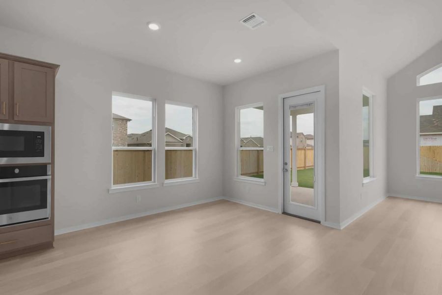 Representative unfurnished interior of a home built from the Madison by Chesmar Homes in University Heights, McKinney (Image 13).