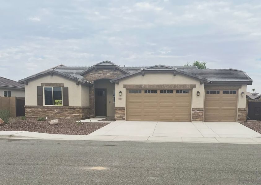 Front exterior of a new home in Acacia at Santana, Yuma, AZ, highlighting curb appeal (Image 1). Front exterior of a new home in Acacia at Santana, Yuma, AZ, highlighting curb appeal (Image 1).
