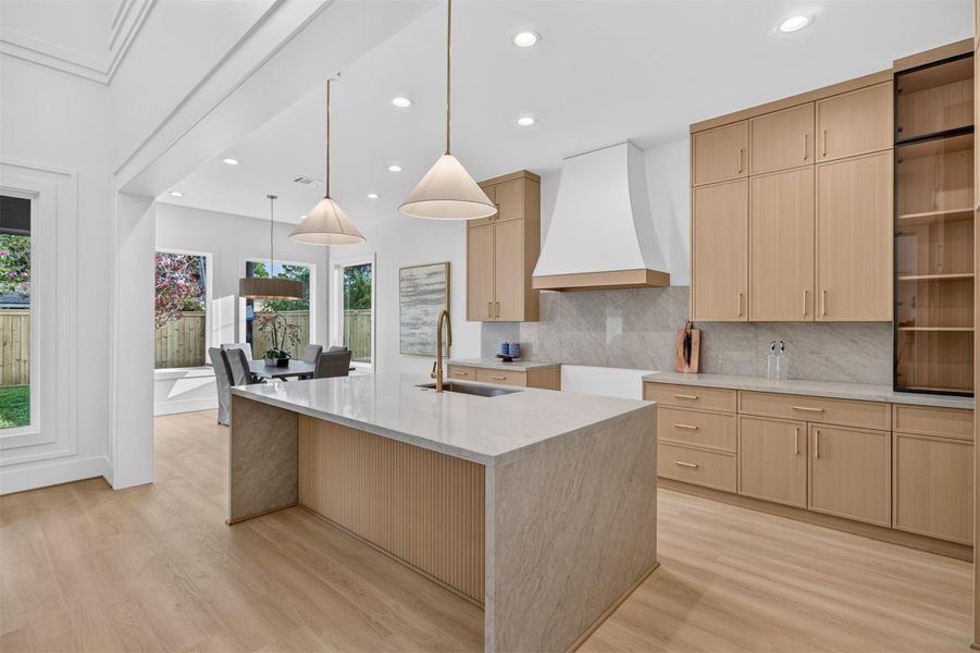 The designer kitchen is beautifully appointed with premium finishes, custom cabinetry, high-end appliances will be included, and an oversized waterfall island perfect for everyday living. The designer kitchen is beautifully appointed with premium finishes, custom cabinetry, high-end appliances will be included, and an oversized waterfall island perfect for everyday living.