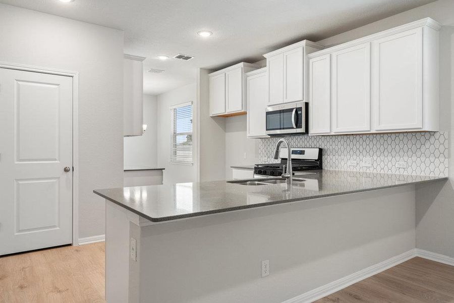 Furnished interior view inside a new home in Sage Hollow, Kyle (Image 4).