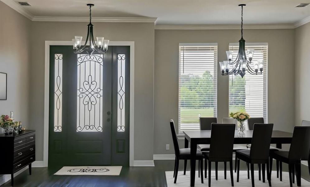 Dining room featuring a chandelier, crown molding, and dark wood-type flooring Dining room featuring a chandelier, crown molding, and dark wood-type flooring