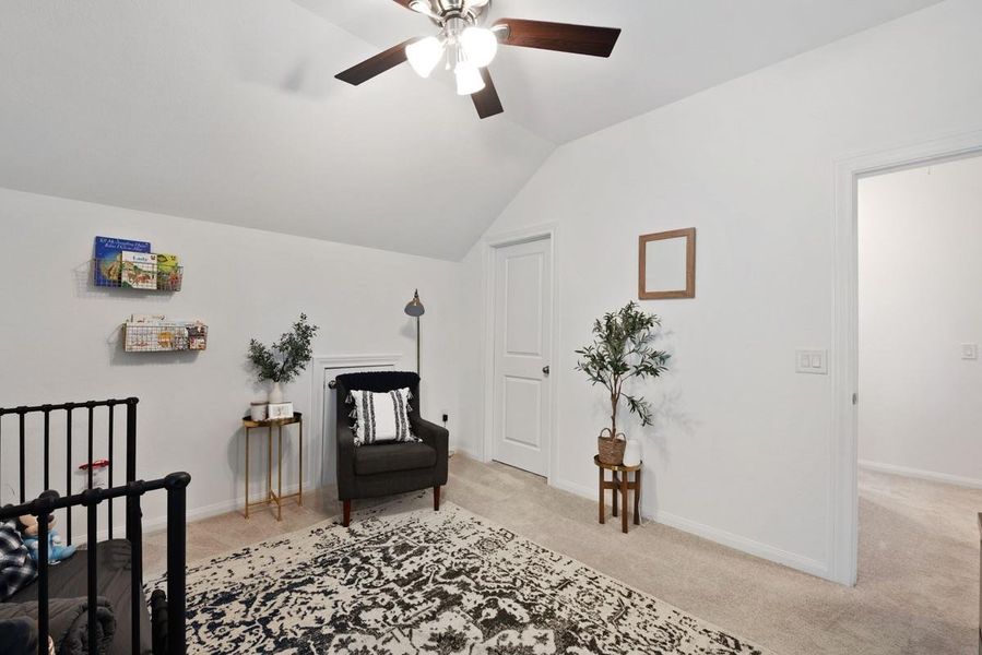 Second bedroom upstairs with ceiling fan and walk in closet. Second bedroom upstairs with ceiling fan and walk in closet.