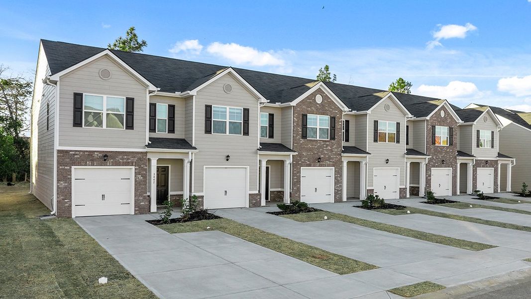 Front exterior of a new home in Laurel Park Townhomes, Hephzibah, GA, highlighting curb appeal (Image 2). Front exterior of a new home in Laurel Park Townhomes, Hephzibah, GA, highlighting curb appeal (Image 2).