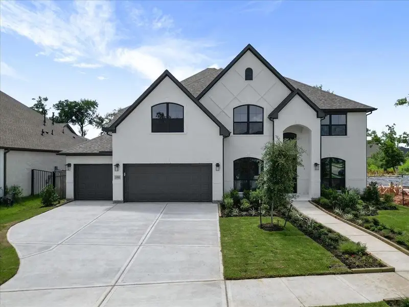 Front exterior of a new home in , Missouri City, TX, highlighting curb appeal (Image 24).