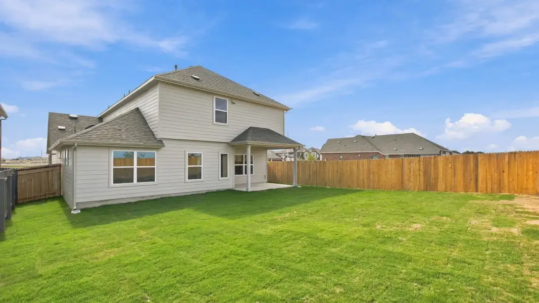 Exterior details and patio area of a home in Carillon, Manor (Image 23).