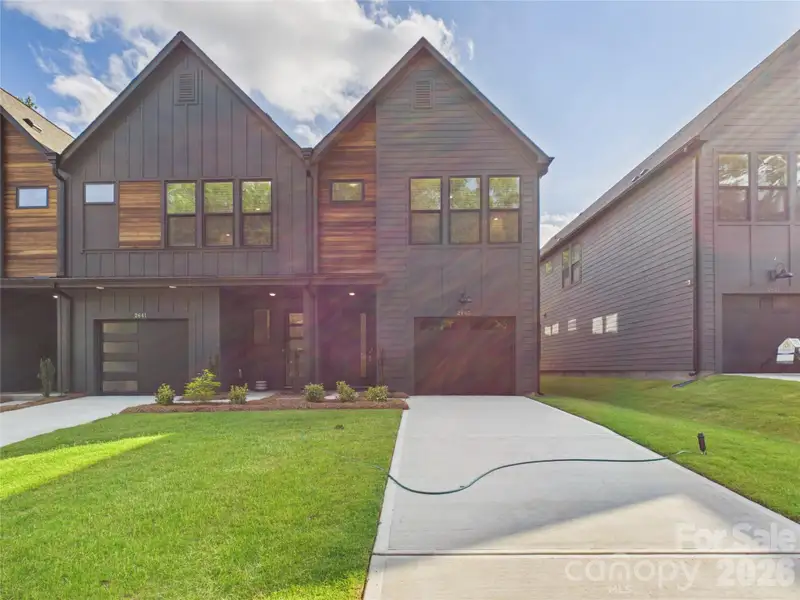 Front exterior of a new home in , Charlotte, NC, highlighting curb appeal (Image 27).