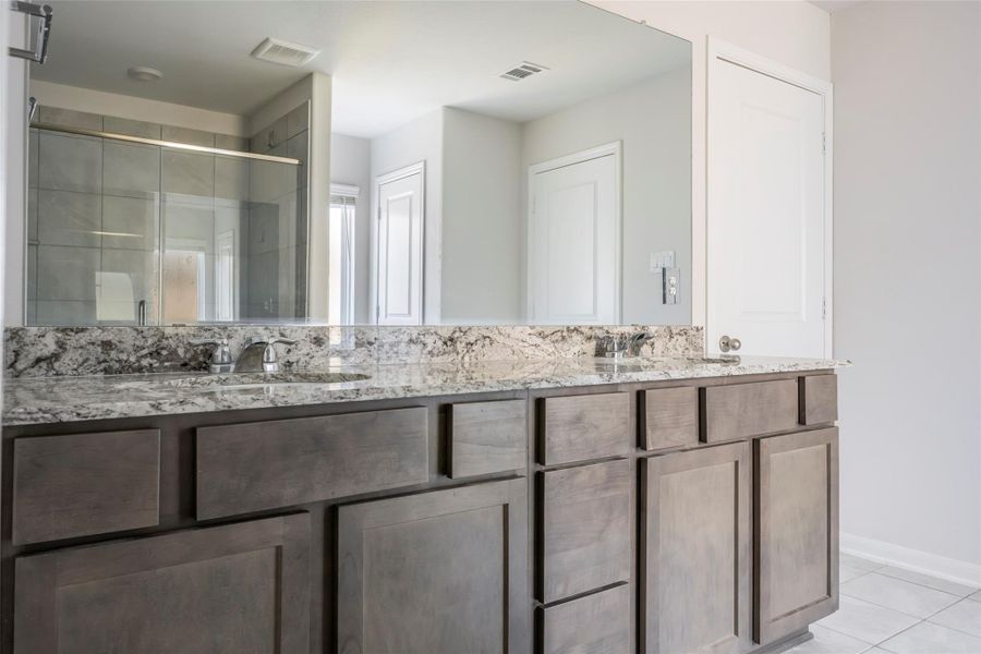 Furnished interior view inside a new home in Sunterra, Katy (Image 11).