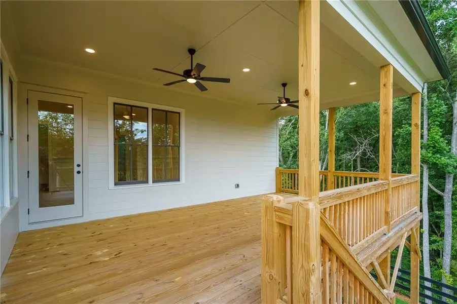 Exterior details and patio area of a home in Malone's Pond, Ball Ground (Image 21).
