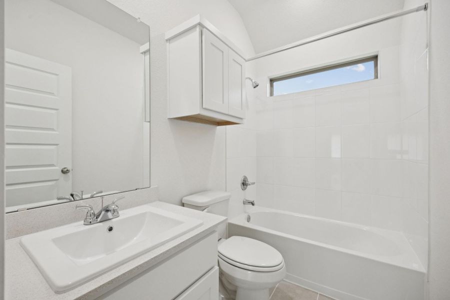 Full bathroom featuring vanity and shower / bath combination