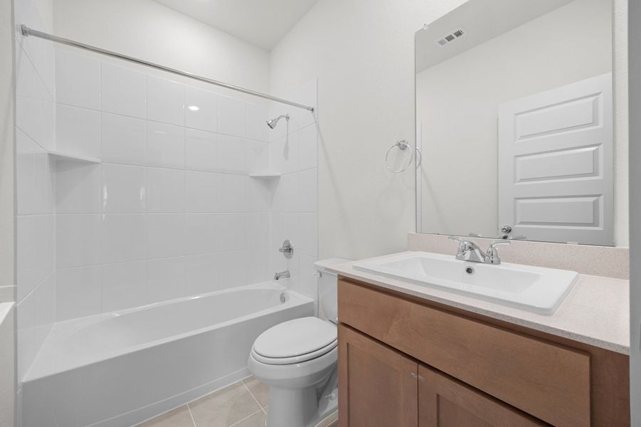 Bathroom in the Sabine home plan by Trophy Signature Homes – REPRESENTATIVE PHOTO Bathroom in the Sabine home plan by Trophy Signature Homes – REPRESENTATIVE PHOTO