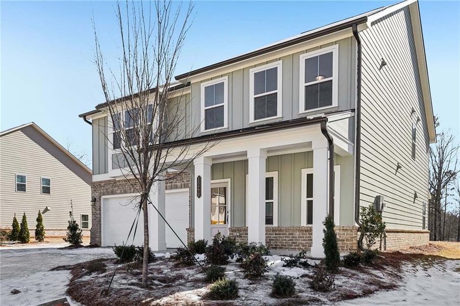 Front exterior of a new home in Arbors at Richland Creek, Buford, GA, highlighting curb appeal (Image 2). Front exterior of a new home in Arbors at Richland Creek, Buford, GA, highlighting curb appeal (Image 2).