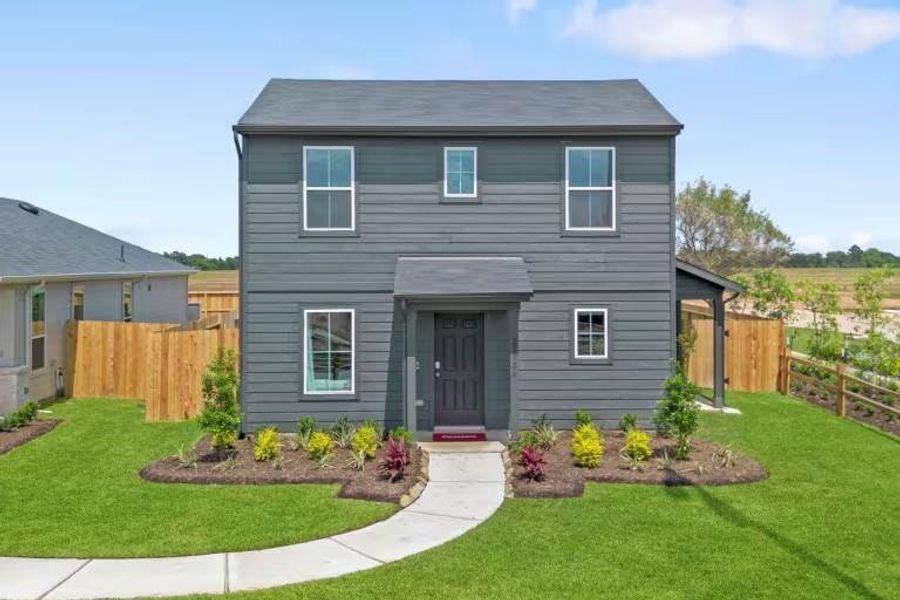 Front exterior of a new home in The Courtyards at Stokesbury, Waller, TX, highlighting curb appeal (Image 2).