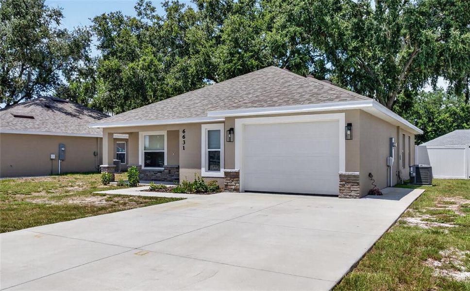 Front exterior of a new home in , Winter Haven, FL, highlighting curb appeal (Image 2).