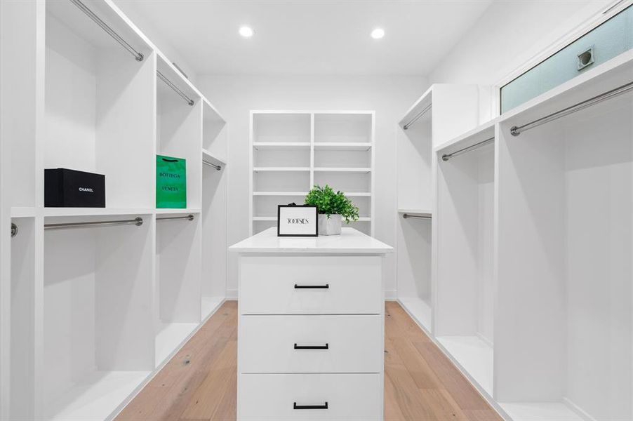 Oversized primary closet is designed for maximum organization.