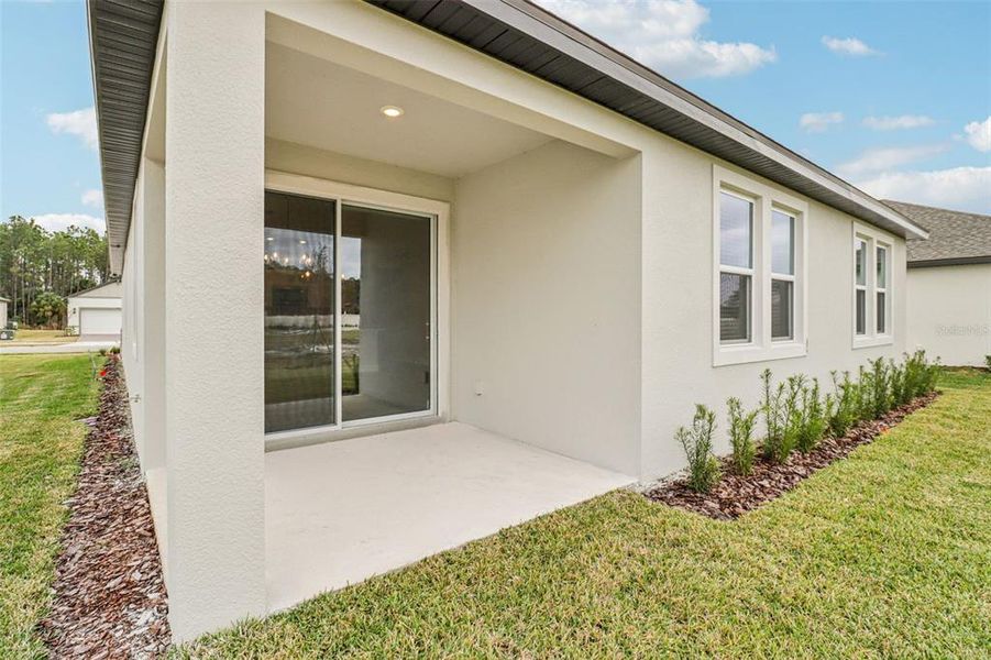 Exterior details and patio area of a home in Legends Preserve - Signature Series, Daytona Beach (Image 4).