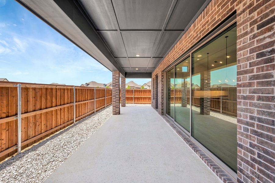 Exterior details and patio area of a home in Elements at Viridian - Garden Series, Arlington (Image 3). Exterior details and patio area of a home in Elements at Viridian - Garden Series, Arlington (Image 3).